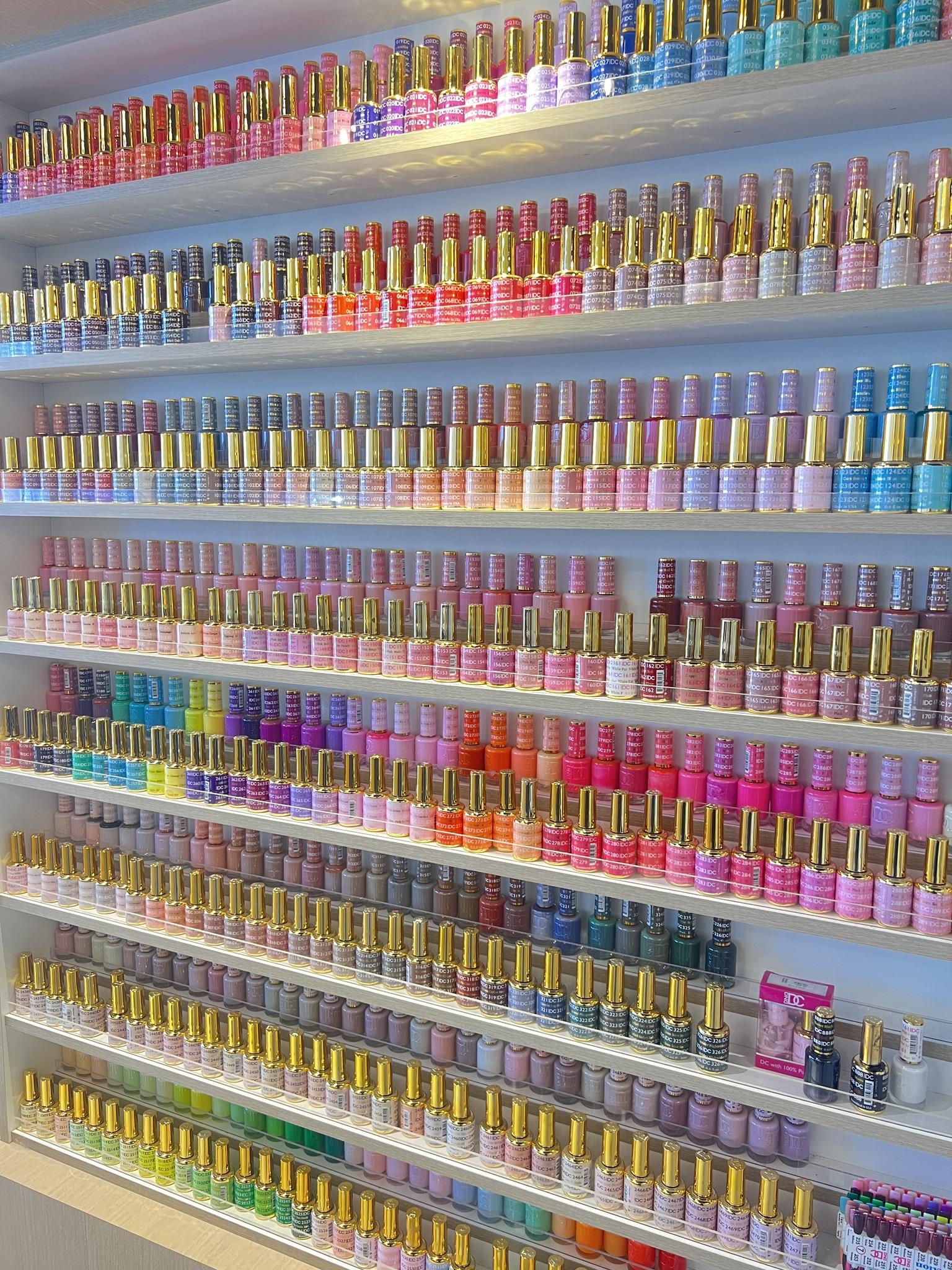 Floor-to-ceiling gel and polish colour wall at NailVibe Cool Springs